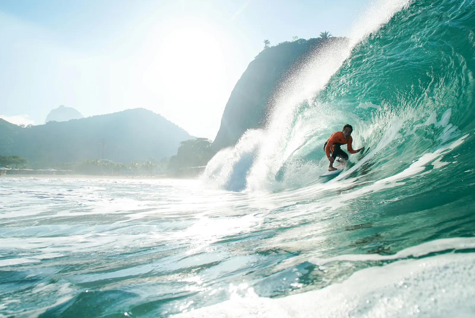 Open Brazilian beach break with a clean wall and offshore spray.